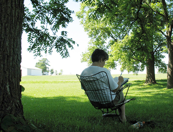 Jan Bechtel drawing among the trees