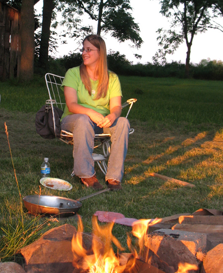 Rachel among the evening shadows just after the dinner we cooked over the open fire
