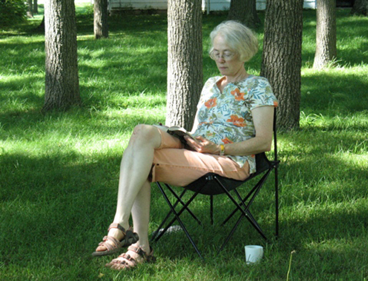 Professor Mary Catherine Harper writes under walnut trees
