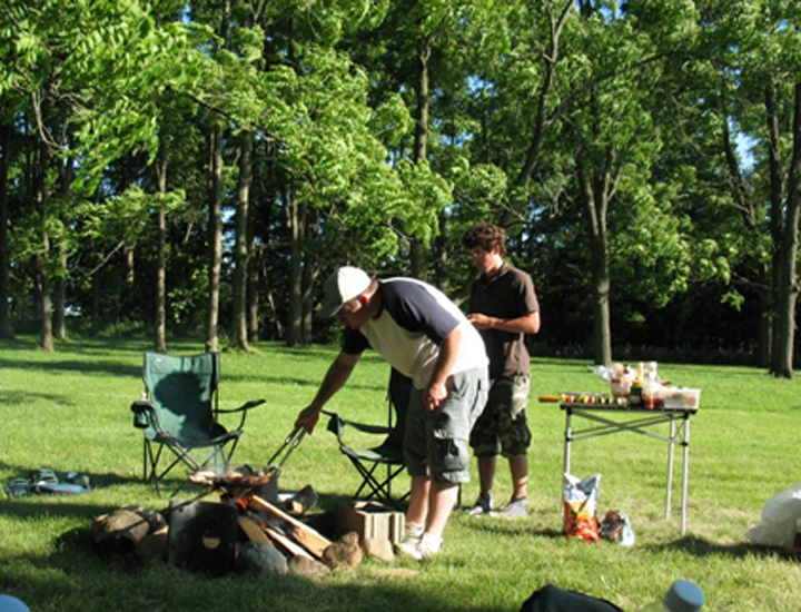 Jared and Tyler tend the late-afternoon fire
