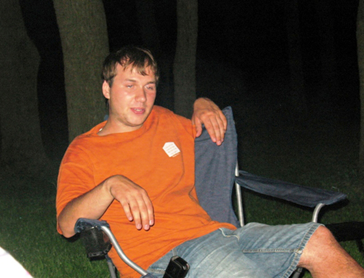 Watching the fire as he listens