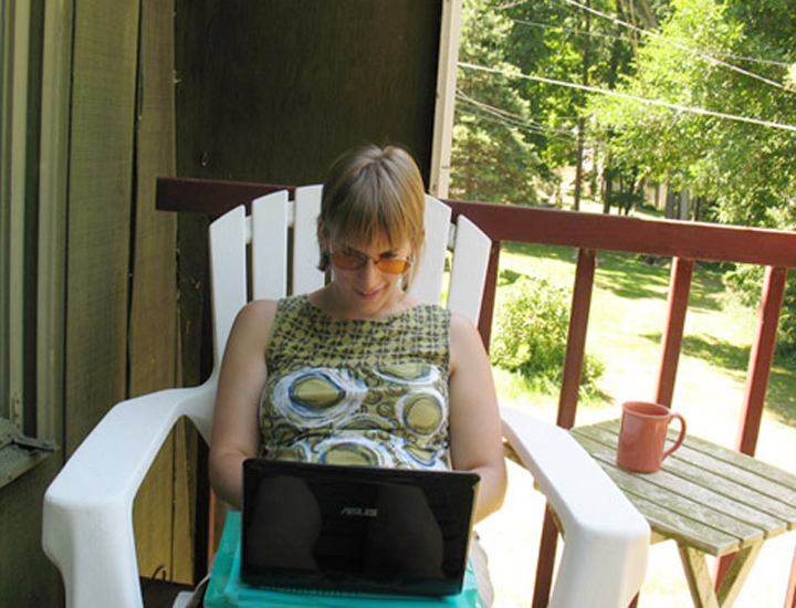 Rachel Baker at work on the retreat house balcony