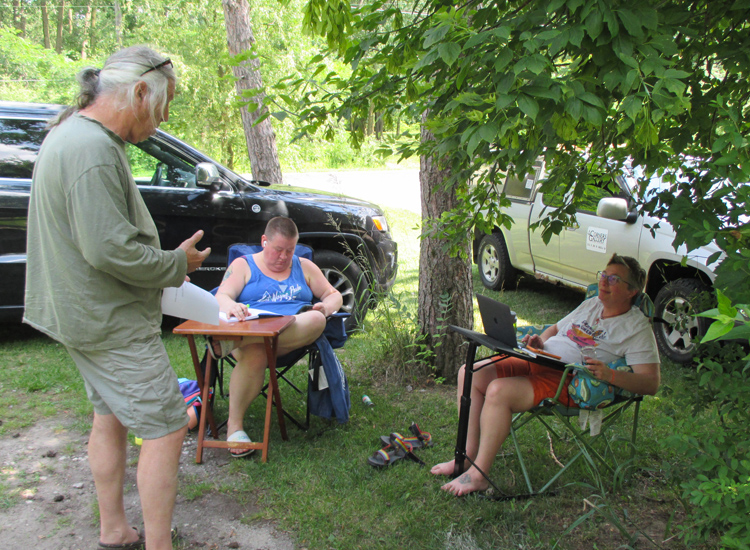 Bex is lost in thought as Steve reads his poem to Dawn.