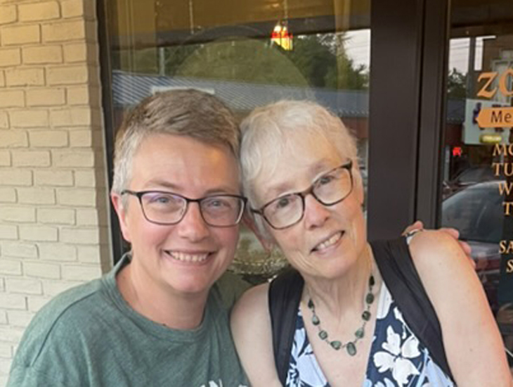 Dawn and Mary Catherine Harper just after a fine dinner in a restaurant