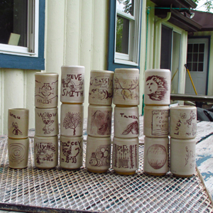 Pottery cups after application of decals and firing in one of Steve's kilns