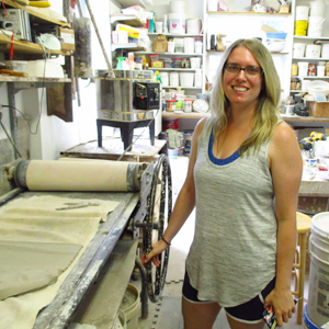 Eva English in the studio at the clay press