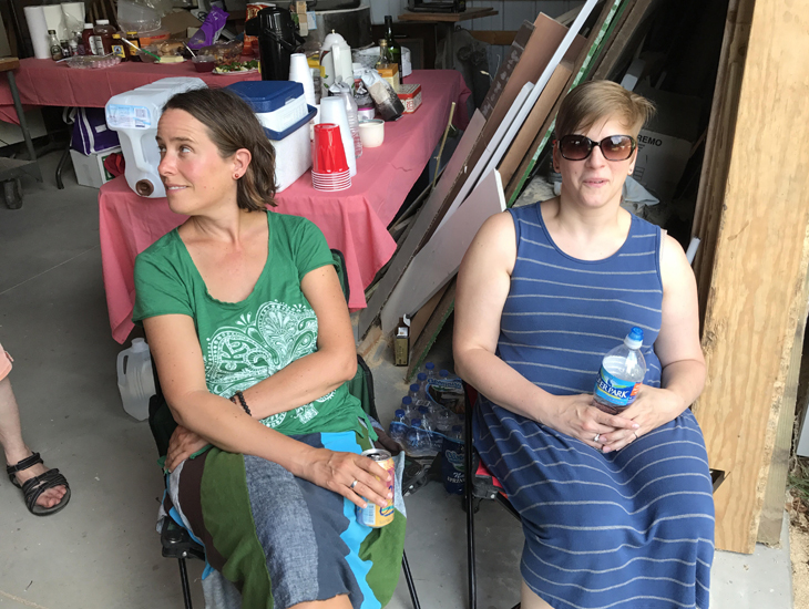 Andrea England and Rachel Baker enjoying the workshop talk from their chairs just inside Steve's wide-open pole barn.