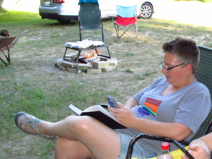 Focused on her phone, Dawn is oblivious to the "sword play."