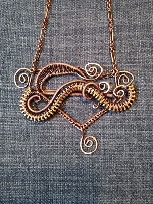 Rachel Baker's necklace . . . with a zipper snaking through the middle
